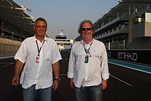 Rennstrecken-Architekten: Hermann Tilke (links) und Peter Wahl, die Geschäftsführenden Gesellschafter der Partner Tilke GmbH & Co. KG auf der Start-und-Zielgerade des Yas Marina Circuit in Abu Dhabi. Foto: L. Gorys/Auto-Reporter.NET